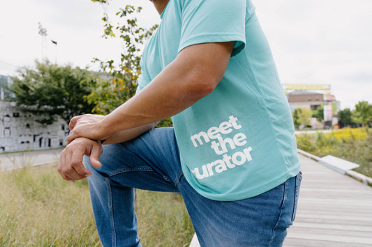 Meet The Curator - Big Face Logo - Meet The Curator: The Boutique