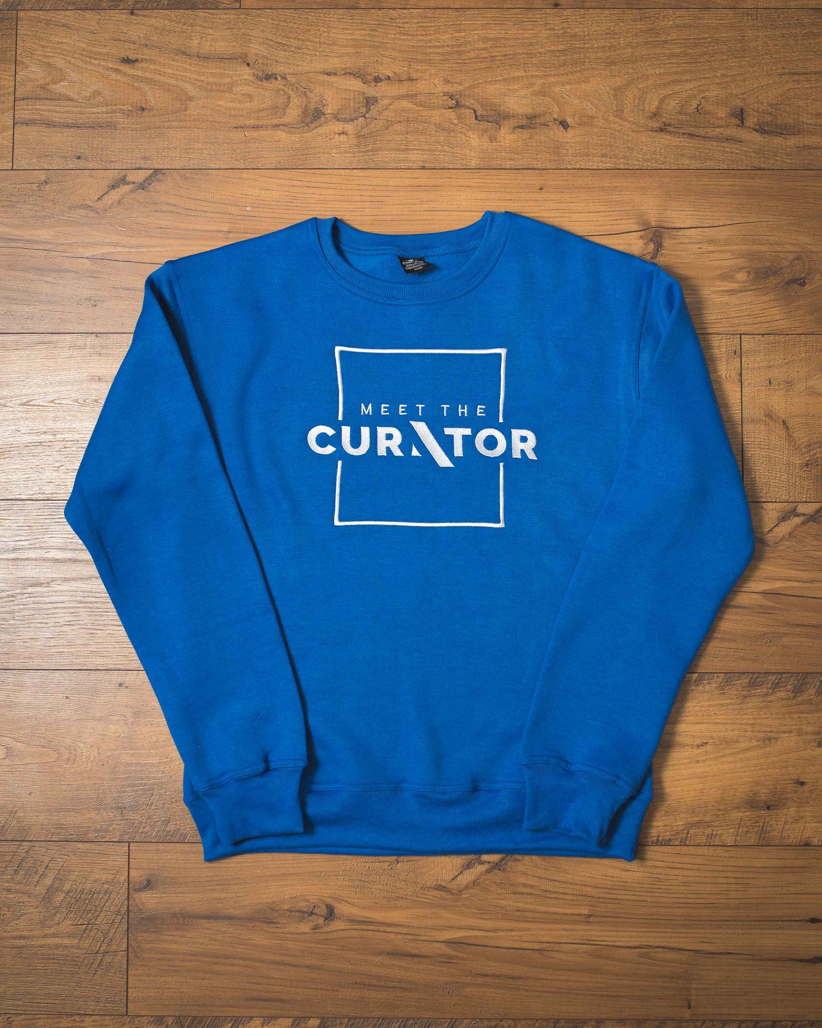 Meet The Curator - Flagship Sweatshirt